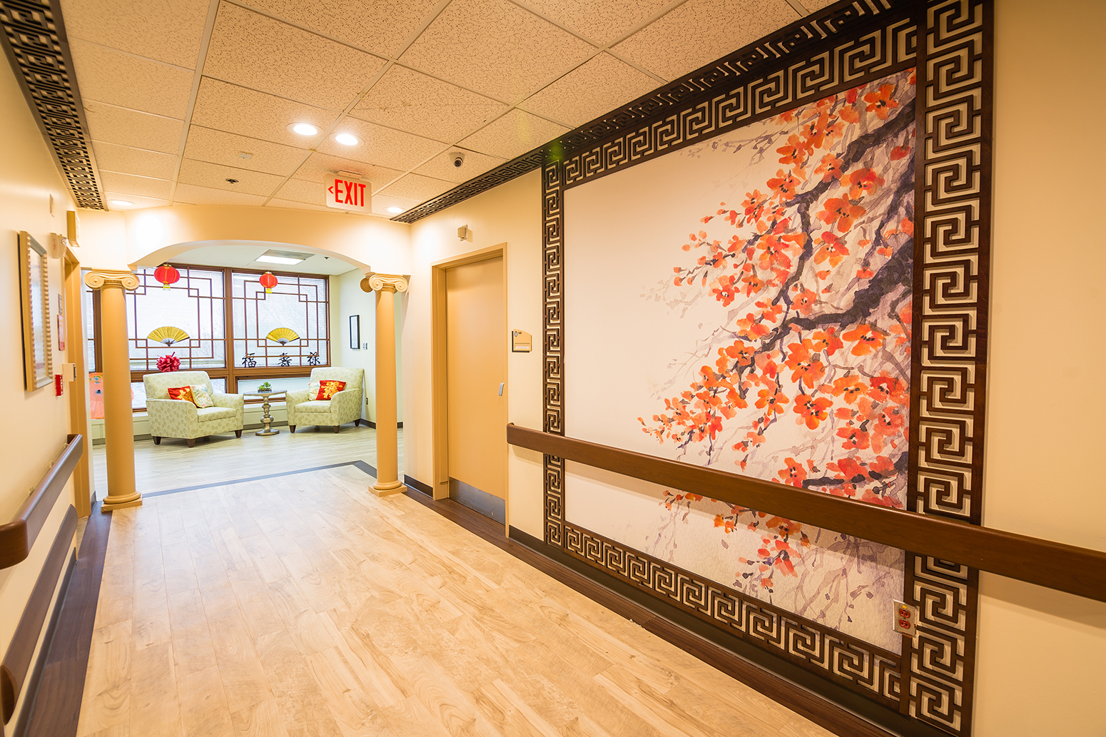 Hallway with large mural of cherry tree